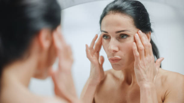 Woman Looking at Her Reflection